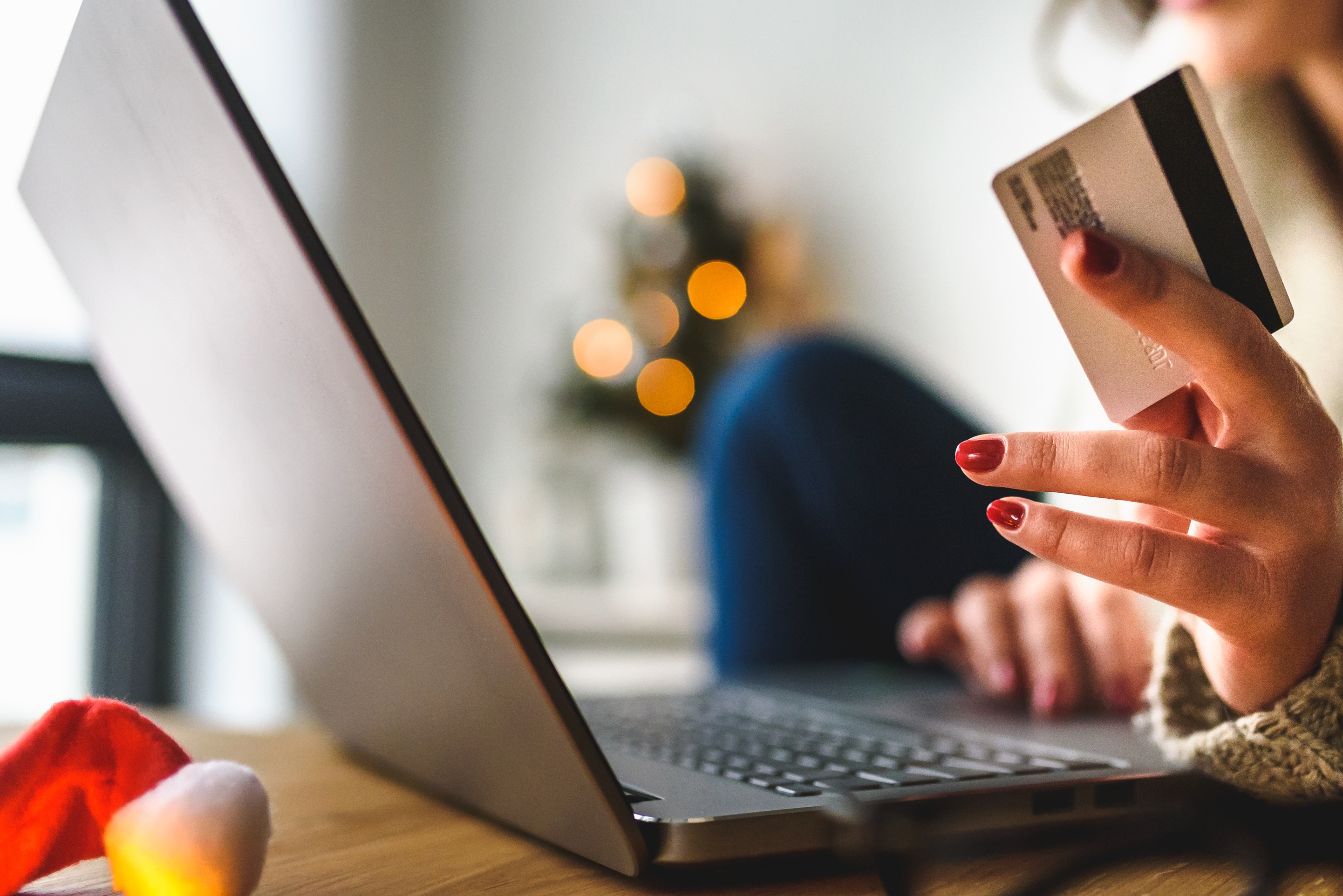 woman online shopping e-commerce during festive holiday season